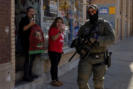The Wider Image: 'Not a life here.' Immigration raids hollow out Chicago neighborhood